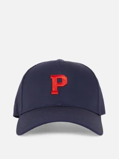 „Rita Ora“ Kappe Mit Aufgestickter Initiale